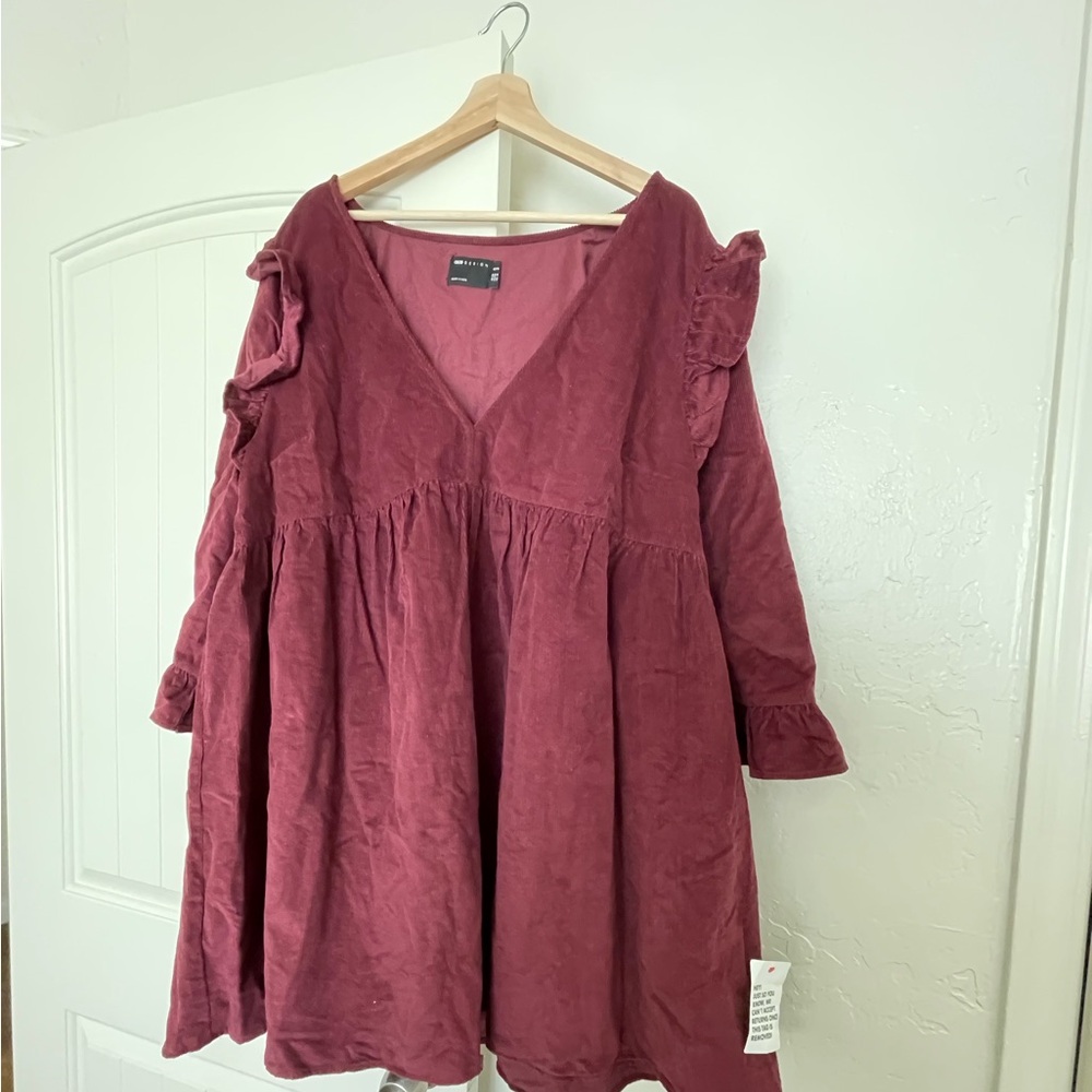 ASOS DESIGN Curve cord mini smock dress with ruffle shoulder in dark berry.